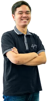 Staff portrait of a team member in company uniform posing confidently in a modern workspace.