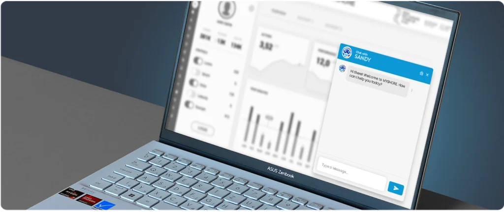 An ASUS Zenbook laptop displaying a business dashboard with a blue "Chat with SANDY" customer support pop-up window in the foreground.