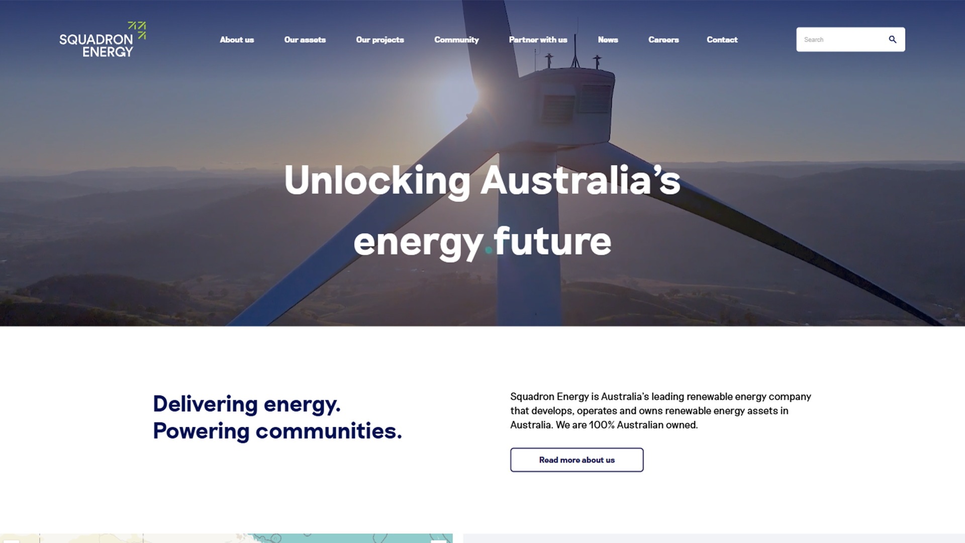 Squadron Energy homepage banner featuring a close-up of a wind turbine nacelle and the headline "Unlocking Australia’s energy future."